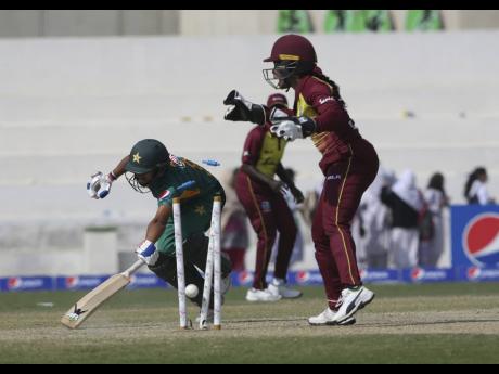 Credit: AP
Pakistan’s batter Nida Dar (left) is run out by Windies Women wicketkeeper Kycia Knight during their first Twenty20 International match played in Karachi, Pakistan on February 7, 2019.