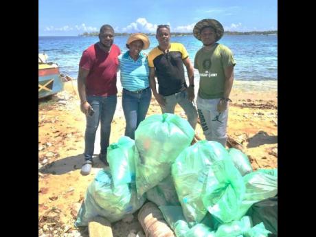Discovery Bauxite employees teamed up with the UWI Marine Laboratory, based in Discovery Bay, to lead a major beach clean-up project at the Old Folly community beach in St Ann that netted 245 kilograms of plastic bottles and general debris from the beach a
