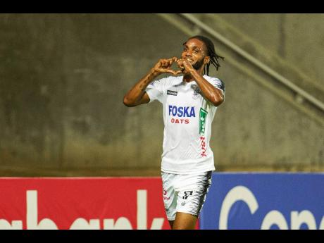 Shaniel Thomas, of Cavalier FC, celebrates one of his goals during the Concacaf Caribbean Cup match between Cavalier SC of Jamaica and Moca FC of the Dominican Republic, at Sabina Park on Tuesday.