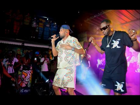 Cham (left) and Bounty Killer perform during the launch event for their collabrative album, ‘Time Bomb’, held on Saturday at Di Lot.
