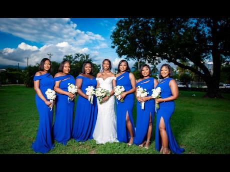 Credit: Contributed The lovely bride, Jheanelle Williams, is surrounded by her six bridesmaids (from left) Talmarie Davis, Nasheake Franice, Karlene Cameron, Kena Benstead, Andrine Williams and Kimberlee Cummings.