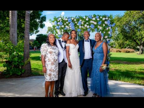 Credit: Contributed The bride and groom are supported by (from left) Sherrill Williams, mother of the groom, and Evan and Lola Cameron, parents of the bride.