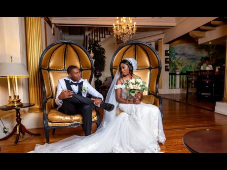 Credit: Contributed Andre (left) is smitten by his bride Jheanelle.