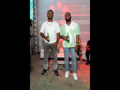 Russell Huie (left) and Heineken Brand Ambassador Adrian Wilson bring beer vibes to Harbour Street on Thursday night.