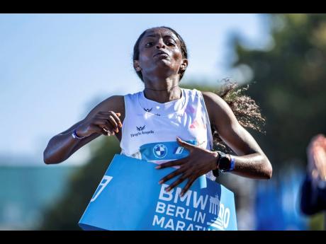 Credit: AP Ethiopia’s Tigst Assefa crosses the finish line in world-record time at the Berlin Marathon on Sunday, September 24, 2023.