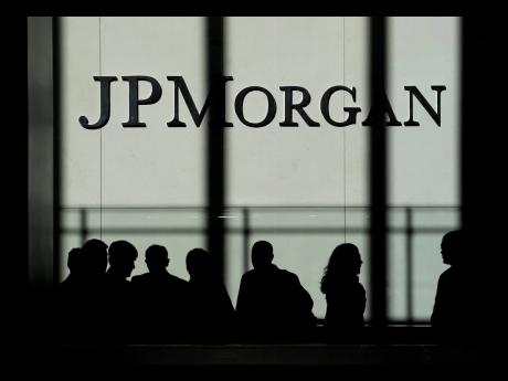 Credit: AP The JPMorgan Chase & Company logo is displayed at their headquarters in New York.