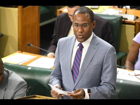 Dr Nigel Clarke, minister of finance and the public service, tables the Third Supplementary Estimates 2023-24 for referral to the Public Administration and Appropriations Committee during yesterday's sitting of the House of Representatives. 
