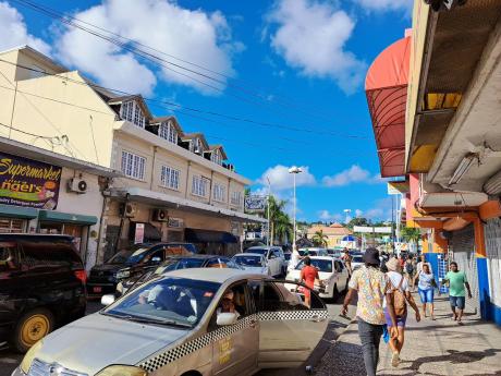 A section of St James Street near Sam Sharpe Square in the heart of Montego Bay. The urban heat island effect occurs when cities replace natural land cover with dense clusters of pavement, buildings and other surfaces that absorb and retain heat.