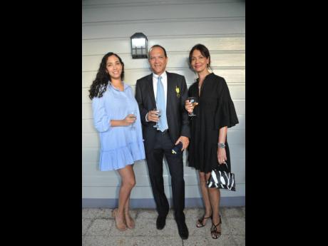 William Tavares-Finson, past dean of the Consular Corps of Jamaica, is flanked by daughter, Victoria Marston (left), and wife, Sandy Finson.
