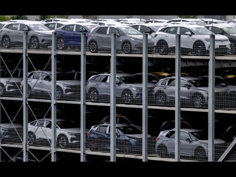 Electric vehicles produced by Volkswagen Saxony park before on the Zwickau plant premises in Zwickau, eastern Germany, Thursday, Sept 14, 2023. The Zwickau plant has been a pioneer of electromobility at Volkswagen. In addition to the ID.3, ID.4 and ID.5 mo