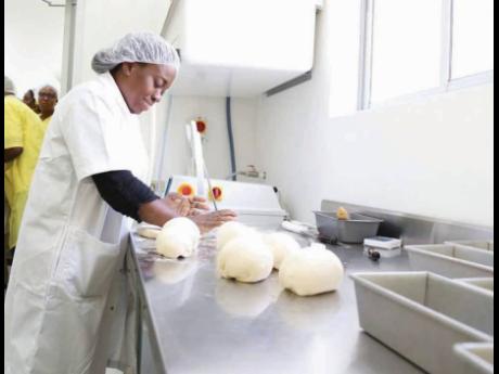 A female worker employed in the food sector.