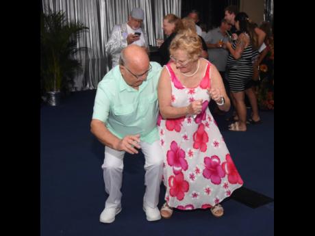 Six-time visitors to the island, Rick and Harriet Bender, show off their dance moves.