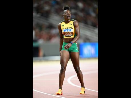 Shericka Jackson watches the replay of her women’s 200 metres final at the National Athletics Centre in Budapest, Hungary just before heading off to celebrate.