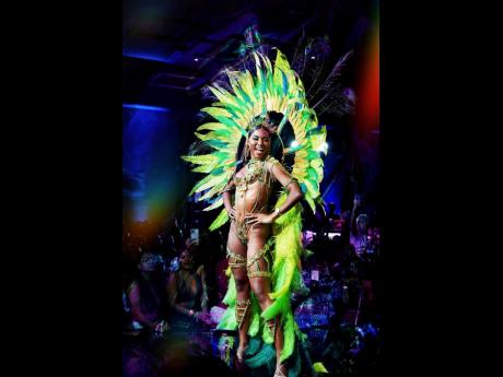 Miss Jamaica World Shanique Singh on stage during the 2022 GenXS band launch. 