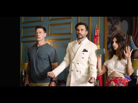 Credit: Contributed John Cena, Juan Pablo Raba and Alison Brie in ‘Freelance’.