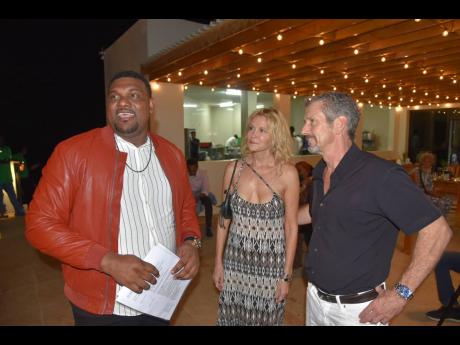 Credit: Herbert McKenis Garth Vickers (left) is captured socialising with two of his friends from the West Cliff Community in Negril, Westmoreland, at the soft opening of his High Life Restaurant.