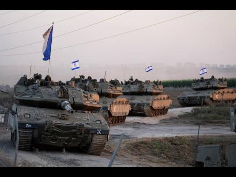 Israeli tanks head towards the Gaza Strip border in southern Israel on October12. 