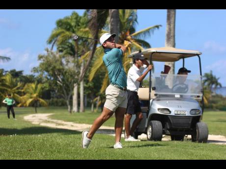 
Jamaica’s Justin Burrowes, who will play in his first pro event today at the Jamaica Open, plays a shot during the pro-am event at the Tryall Club yesterday.