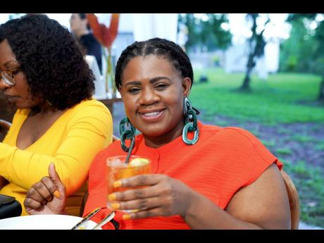  Communications specialist, Faun Fuller enjoys a Worthy Park signature cocktail Apple Jack Sprat after a tour of the estate.