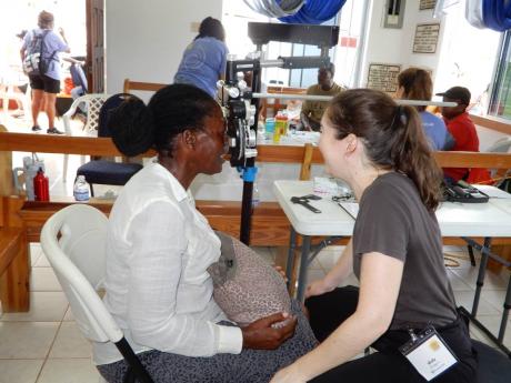  A resident gets her eyes checked by a professional from iCare.