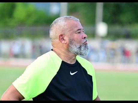 Mona High School head coach Craig Butler looks on during an ISSA/Digicel Manning Cup clash against Jamaica College at the Ashenheim Stadium yesterday. 