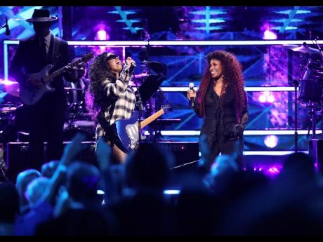 H.E.R., left, and Chaka Khan perform during the Rock & Roll Hall of Fame Induction Ceremony at the Barclays Center. 