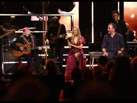From left, Willie Nelson, Sheryl Crow, and Dave Matthews perform during the Rock & Roll Hall of Fame Induction Ceremony.
