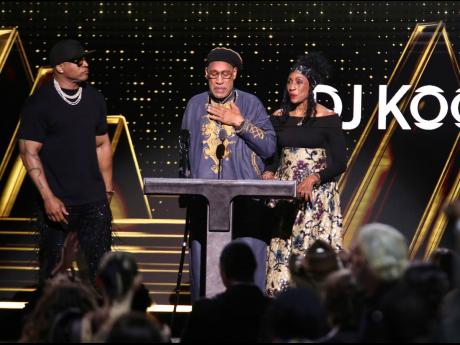 DJ Kool Herc, centre, speaks as LL Cool J, left, and Cindy Campbell look on during the Rock & Roll Hall of Fame Induction Ceremony at Barclays Center in New York.