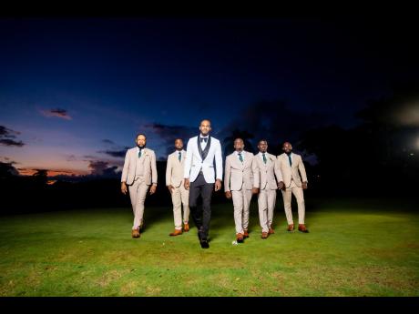 On the walk to forever with his bride, the dapper groom, suited for love, is accompanied by his band of groomsmen (from left) Charles Barette; best man, Kavarie Tucker; Ricardo Gabbidan; Shane Green; and Dean Peart.