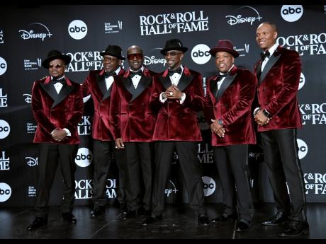 Credit: AP From left: Ricky Bell, Bobby Brown, Johnny Gill, Ralph Tresvant, Michael Bivins, and Ronnie DeVoe of New Edition pose in the press room during the Rock & Roll Hall of Fame Induction Ceremony on November 3 at the Barclays Center in New York.