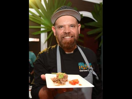 Credit: Ian Allen Miami’s Chef Ceasar Zapata delights with his five-spice roasted pork, accompanied by red onions, tomatoes, fresh herbs, and Scotch bonnet Nuoc Cham, guaranteed to bring a smile to any food lover’s face.