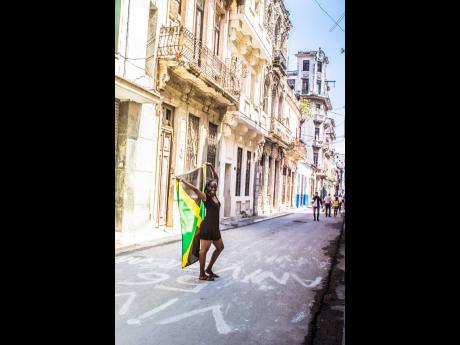 McKenzie struts on the streets of Havana during her first solo trip to Cuba in 2016.