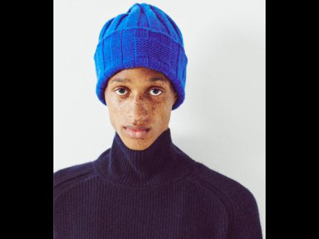 Credit: Contributed SAINT International star Romaine Dixon in a cobalt rib hat and midnight cropped rib turtleneck from Guest in Residence’s Winter 2023 collection campaign.