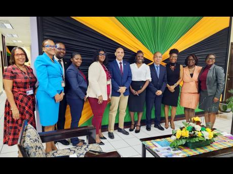 Credit: Contributed Team members of the National Police Wives Association Jamaica (NPWA) pose with members of the Jamaica Constabulary Force (JCF) High Command, including Commissioner of Police Major Antony Anderson (centre). The NPWA paid a courtesy visit to the Commissione