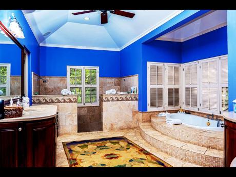 Credit: Contributed The principal bathroom holds your attention effortlessly.