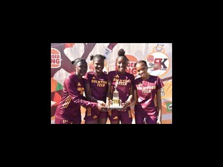 From left: Holmwood Technical’s Florence Nafamba (second leg), Terrica Clarke (third leg), Andrene Peart (first leg), and Cindy Rose (anchor) winners of the  female 4x1500m relay at the Burger King 5K & Relays at the Portmore Mall, St. Catherine, on Nove