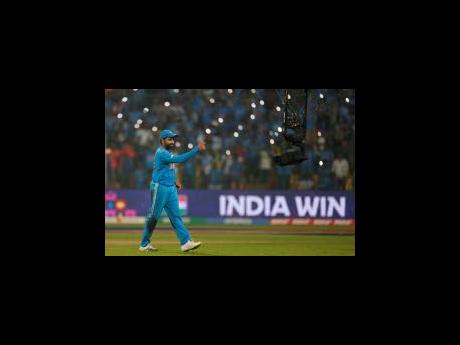 Credit: AP India’s captain Rohit Sharma reacts as he celebrates after winning the ICC Men’s Cricket World Cup match against Netherlands in Bengaluru, India on Sunday, November 12.