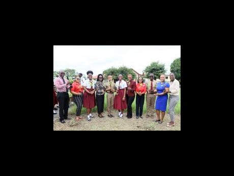 Glenmuir High School was the recipient of over 200 plants as the National Health Fund (NHF) partners with educational institutions to plant 20,000 trees for its 20th anniversary From left: Upton Williams (advisor, Environmental Club); Saeyna Stanbury, chie