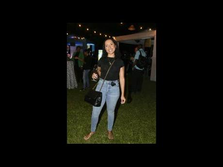 Credit: Kenyon Hemans A smile and a glass of red wine are enough for hospitality and tourism consultant Melissa McFarlane to have a good time.