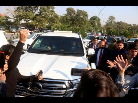 A vehicle carrying former Pakistan Prime Minister Nawaz Sharif arrives at Islamabad High court in Islamabad, Pakistan, yesterday. A court in Islamabad briefly heard an appeal from former Prime Minister Imran Khan’s main political rival, Nawaz Sharif, aga