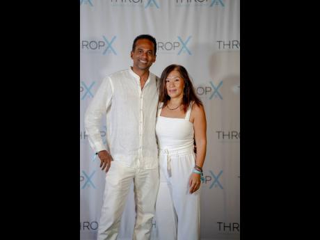 Vivene Levison, managing director of Great Huts, accompanied by her husband Dr Carey Wallace at the Throp-X Jamaica Investment Conference farewell party.