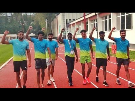 Contributed 
INDIAN RECORD BREAKERS IN BUDAPEST: Muhammed Anas,  Amoj Jacob, Muhammad Ajmal, coach Jason Dawson, Rajesh  Ramjesh, Arul  Rajalingam, and Mijo Chacko Kurian get ready to do battle at the World Athletics Championships in Budapest. 