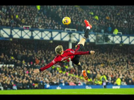 Credit: AP Manchester United’s Alejandro Garnacho scores his side’s first goal during the English Premier League match between Everton and Manchester United, at Goodison Park Stadium, in Liverpool, England yesterday.