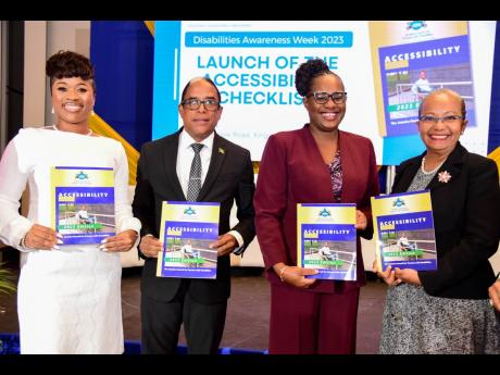 Minister of State in the Ministry of Labour and Social Security,  Dr Norman Dunn and (from left) Legal Officer, Jamaica Council for Persons with Disabilities (JCPD), Janel Williams; Executive Director of the Jamaica Council for Persons with Disabilities, D