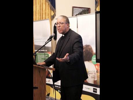 Reverend Michael King, from King of Kings International Ministries, gives an inspirational talk and the opening prayer at the GJDC launch event.