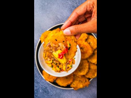 A match made in foodie heaven looks quite like ackee and saltfish served with pressed green plantains.