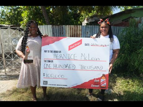Credit: Contributed Bernice McLean (left) beams with pride alongside her daughter, Dadrea McLean, after receiving the Red Stripe ‘Suh Wi Dweet - Everyday Hero Award’.