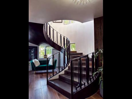 The interior boasts an imposing feature-the absolutely stunning, floating spiral staircase.