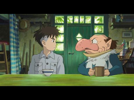Mahito Maki, voiced by Luca Padovan in English and Soma Santoki in Japanese, left, and Grey Heron, voiced by Robert Pattinson in English and Masaki Suda in Japanese, in a scene from Hayao Miyazaki’s ‘The Boy And The Heron’.
