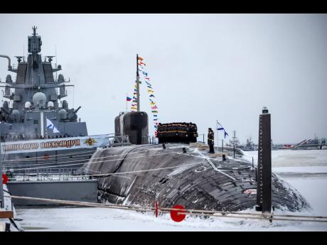 Credit: Mikhail Klimentyev Russian sailors stand on deck of the newly-built nuclear submarine ‘The Emperor Alexander III’ as Russian President Vladimir Putin attends a flag-raising ceremony for newly-built nuclear submarines at the Sevmash shipyard in Severodvinsk, Russia on Mon